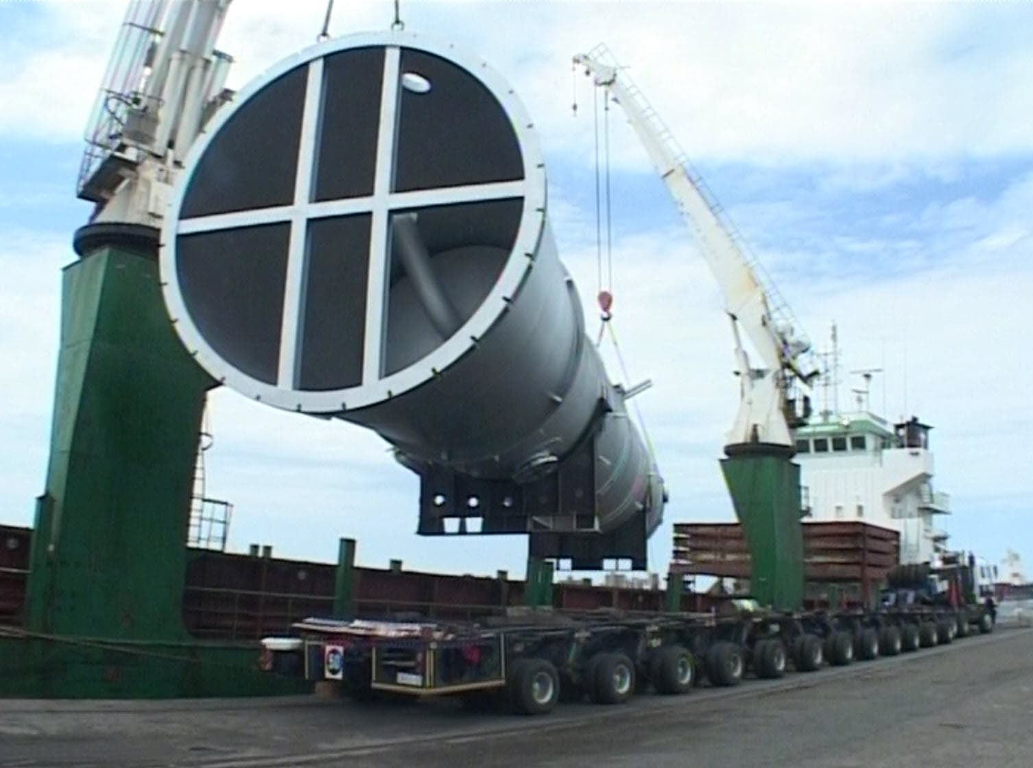 Crane lifts tower from truck