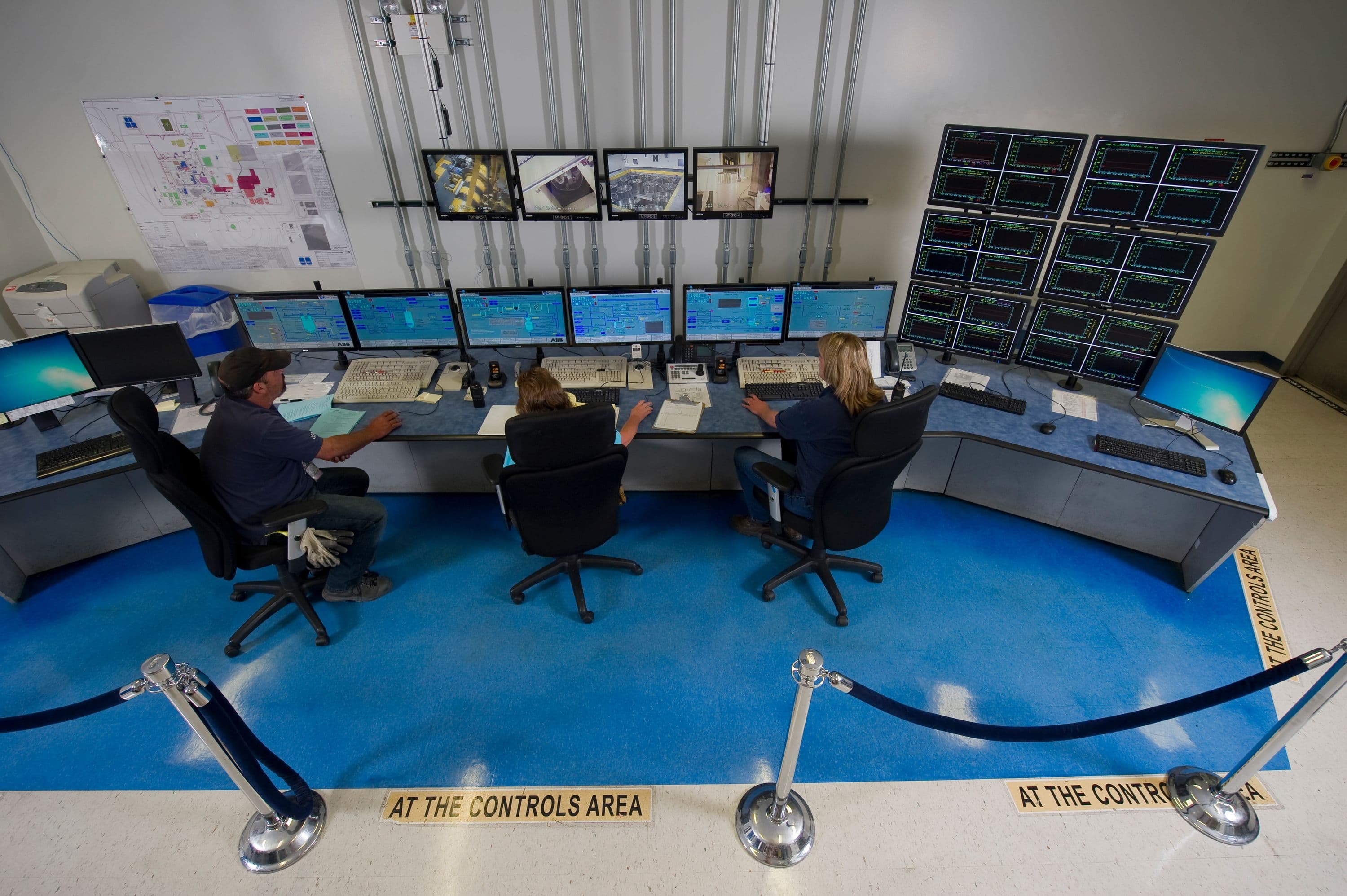 Operators at the Integrated Waste Treatment Unit monitor the plant's condition