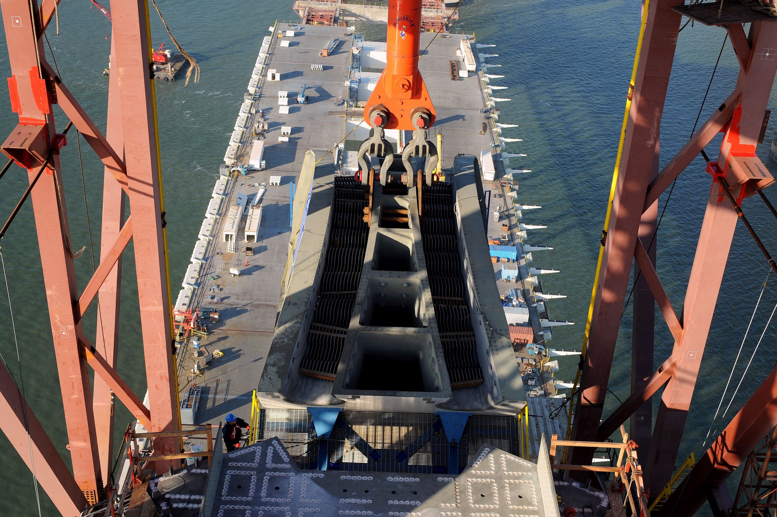 Cable saddle approaching grillage atop SAS bridge tower. Photo © Joseph A. Blum