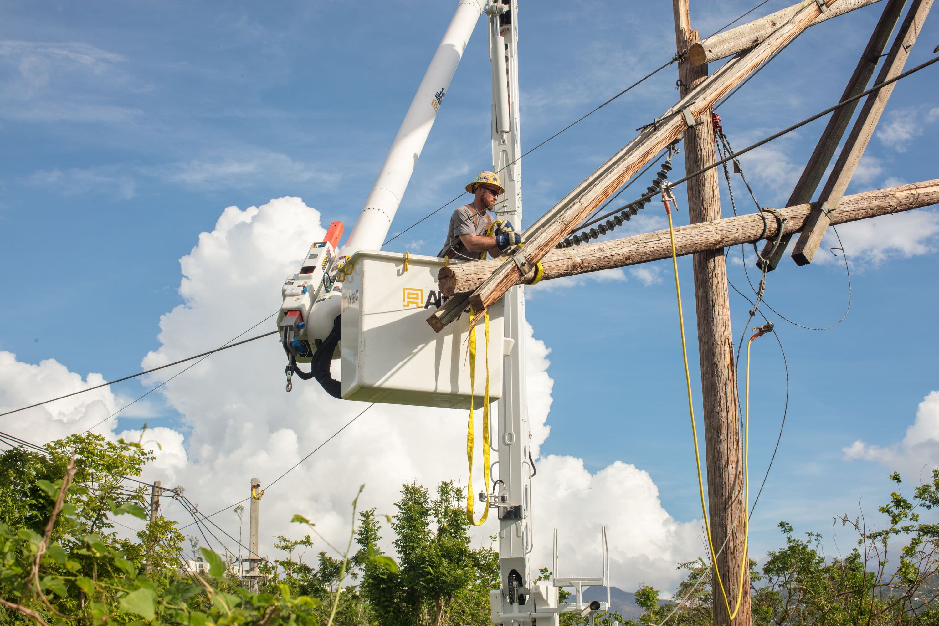 Crewman in lift working on power line